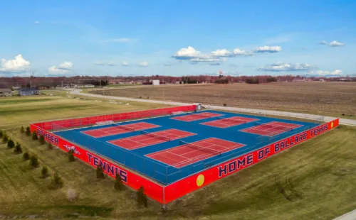 aerial view of tennis courts with fully printed privacy screen