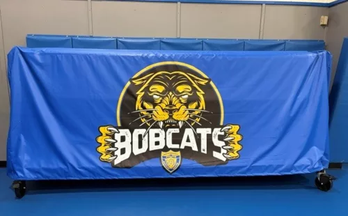 Blue Gymguard mobile rack cover fitted on a Bobcat rack